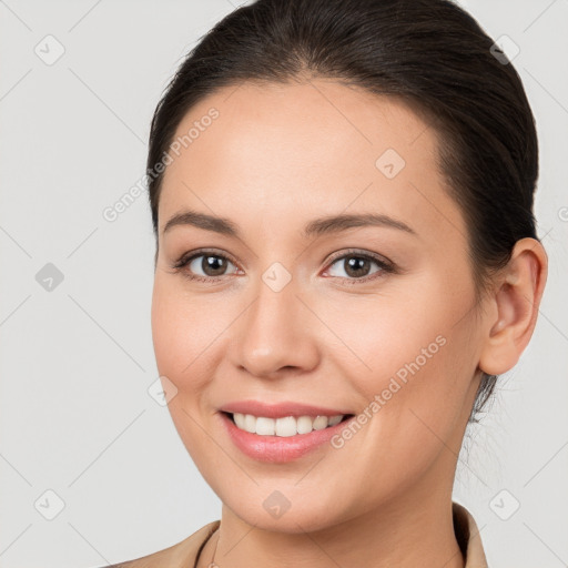 Joyful white young-adult female with medium  brown hair and brown eyes