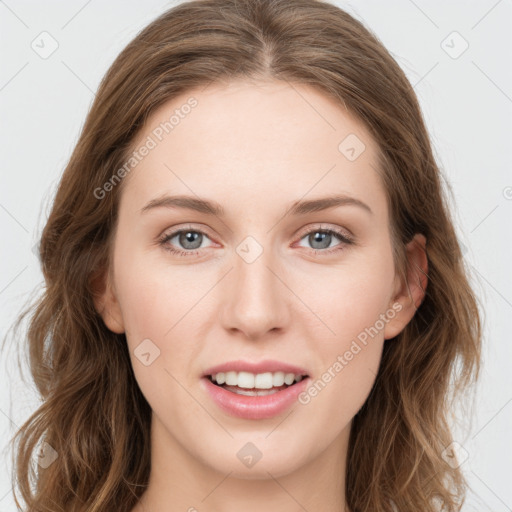 Joyful white young-adult female with long  brown hair and blue eyes