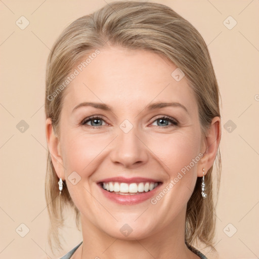 Joyful white young-adult female with medium  brown hair and blue eyes