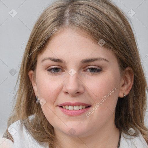 Joyful white young-adult female with long  brown hair and blue eyes