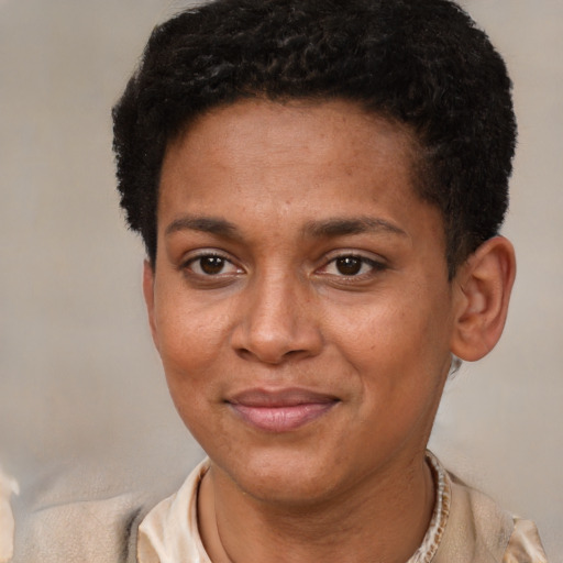 Joyful black adult female with short  brown hair and brown eyes