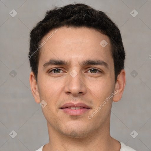 Joyful white young-adult male with short  brown hair and brown eyes