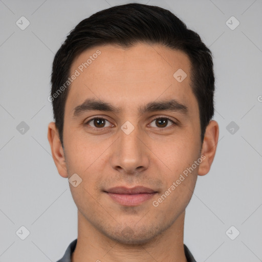 Joyful white young-adult male with short  black hair and brown eyes