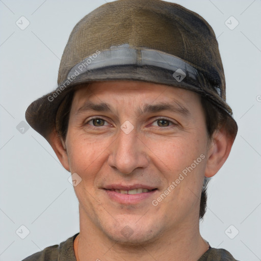 Joyful white adult male with short  brown hair and grey eyes