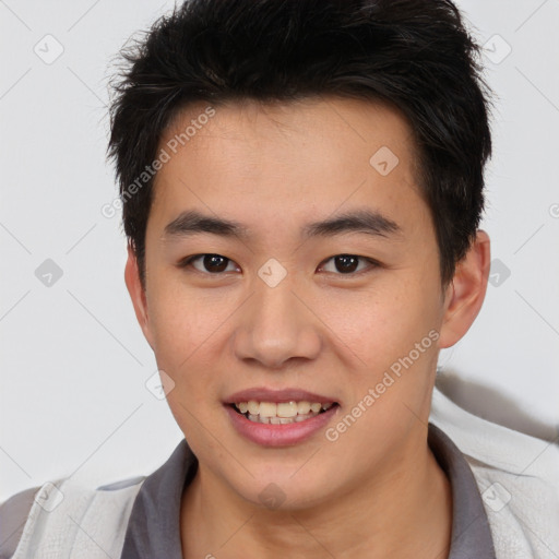 Joyful asian young-adult male with short  brown hair and brown eyes