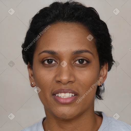 Joyful black young-adult female with short  black hair and brown eyes