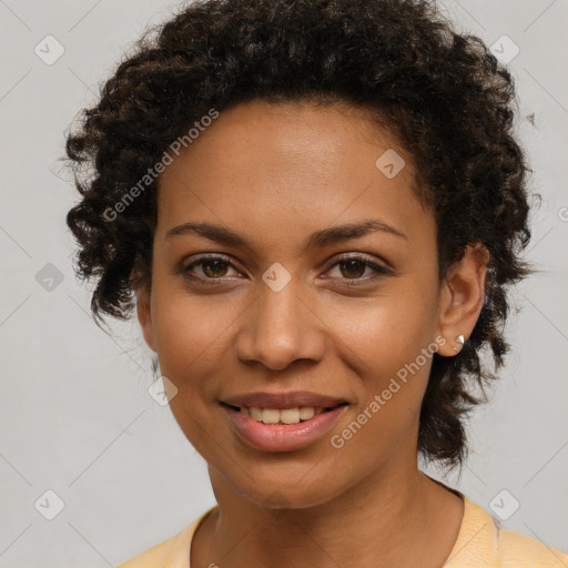 Joyful black young-adult female with medium  brown hair and brown eyes