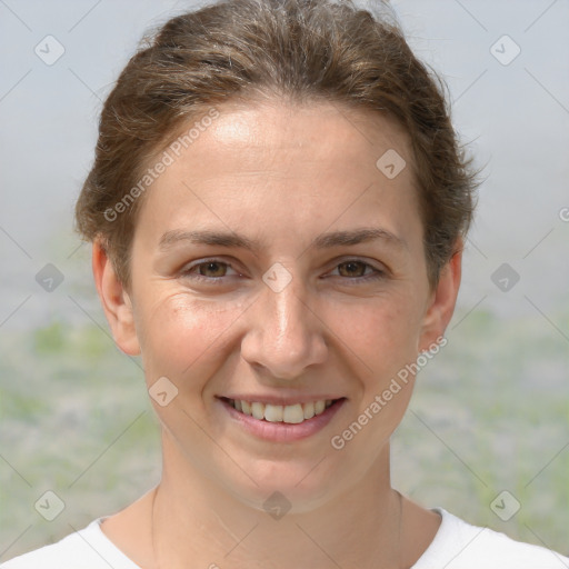 Joyful white adult female with short  brown hair and grey eyes