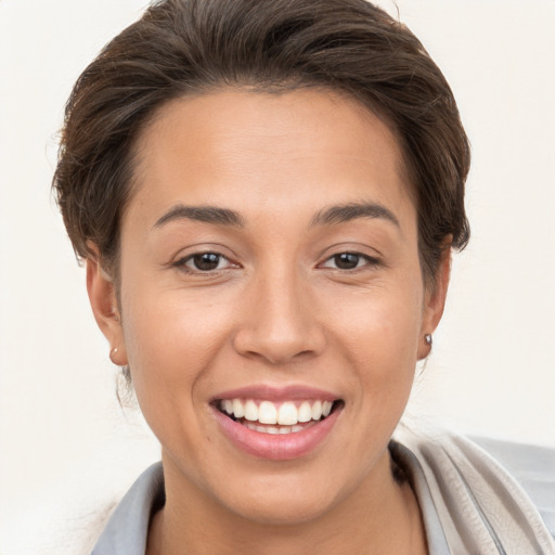 Joyful white young-adult female with short  brown hair and brown eyes