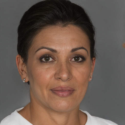 Joyful white adult female with short  brown hair and brown eyes