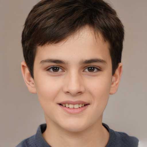 Joyful white child male with short  brown hair and brown eyes