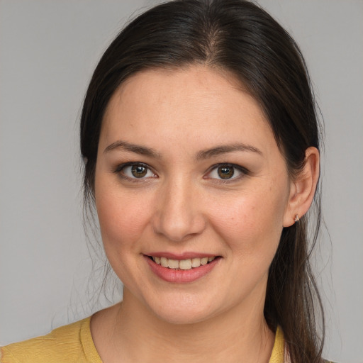 Joyful white young-adult female with medium  brown hair and brown eyes