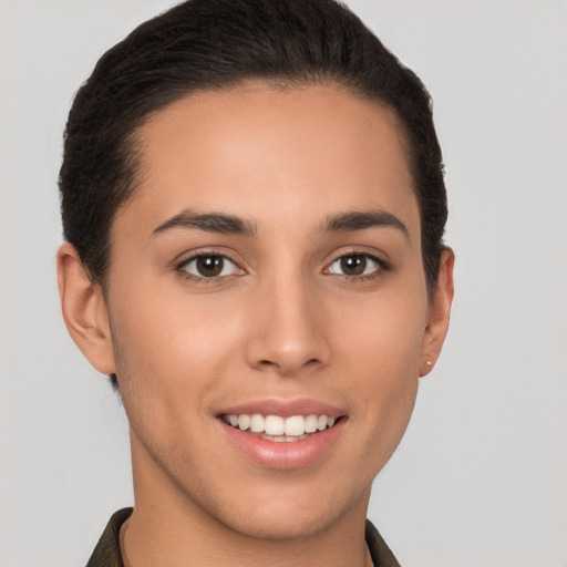 Joyful latino young-adult female with short  brown hair and brown eyes