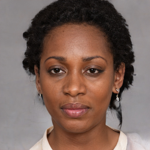 Neutral black young-adult female with medium  black hair and brown eyes