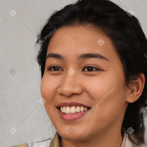 Joyful asian young-adult female with medium  brown hair and brown eyes