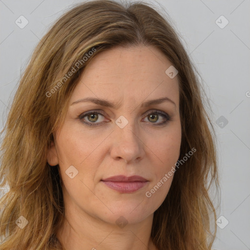 Joyful white adult female with long  brown hair and brown eyes