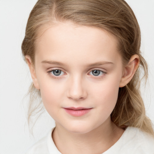 Joyful white child female with medium  brown hair and blue eyes