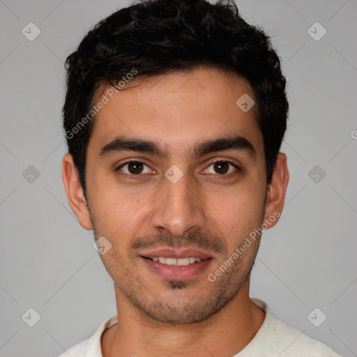 Joyful white young-adult male with short  black hair and brown eyes