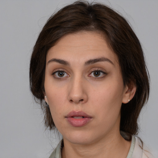 Neutral white young-adult female with medium  brown hair and brown eyes