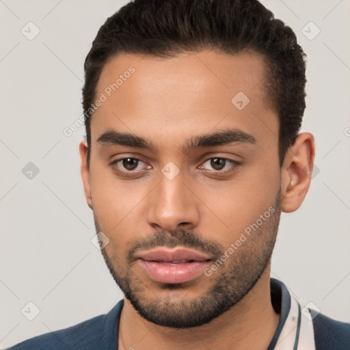 Neutral white young-adult male with short  brown hair and brown eyes