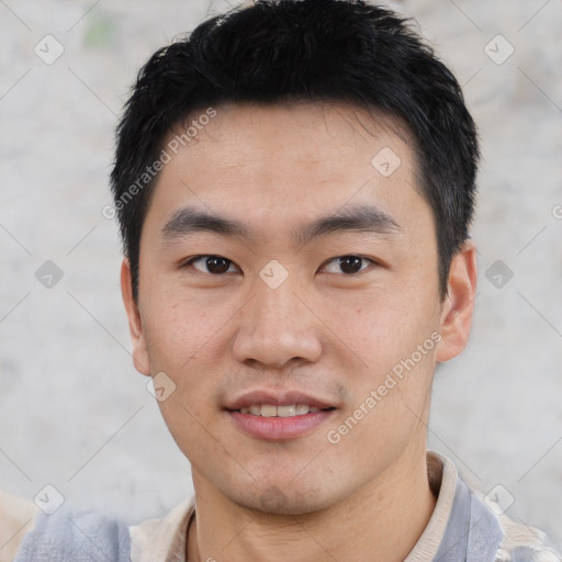 Joyful asian young-adult male with short  black hair and brown eyes