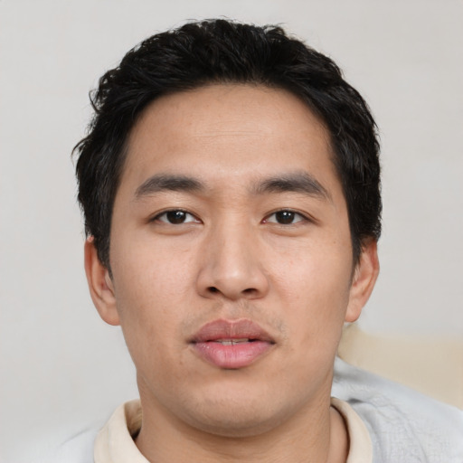 Neutral asian young-adult male with short  black hair and brown eyes