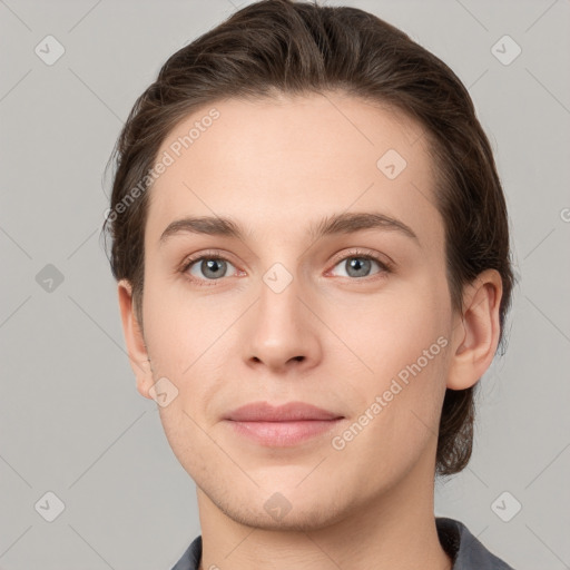 Joyful white young-adult female with short  brown hair and grey eyes