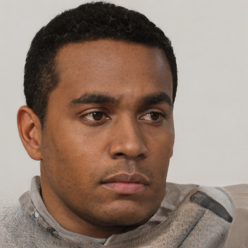 Neutral black young-adult male with short  brown hair and brown eyes