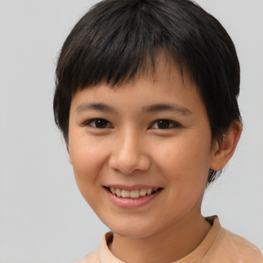Joyful asian child female with short  brown hair and brown eyes