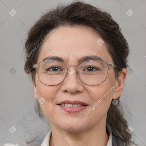 Joyful white adult female with medium  brown hair and brown eyes