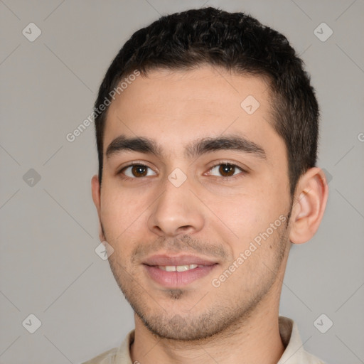 Joyful white young-adult male with short  black hair and brown eyes