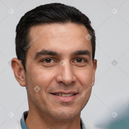 Joyful white adult male with short  black hair and brown eyes