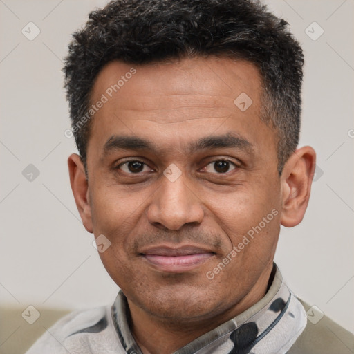 Joyful latino adult male with short  black hair and brown eyes