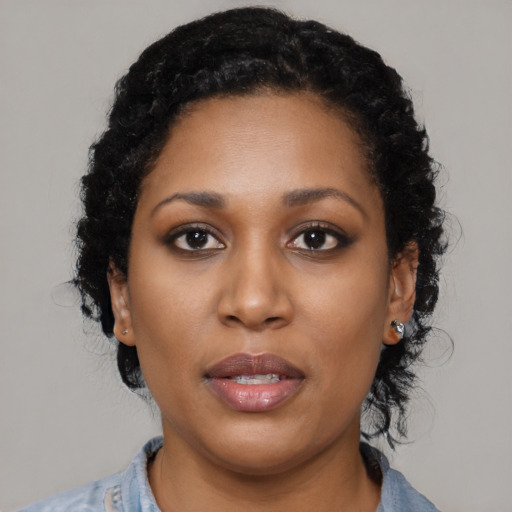 Neutral black young-adult female with medium  black hair and brown eyes