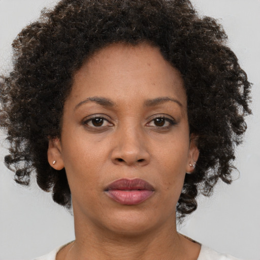 Neutral black adult female with short  brown hair and brown eyes