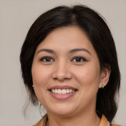 Joyful white young-adult female with medium  brown hair and brown eyes