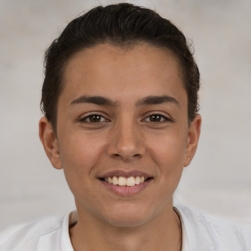 Joyful white young-adult female with short  brown hair and brown eyes