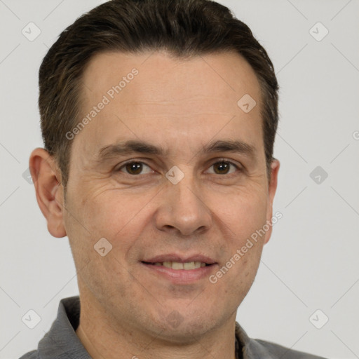 Joyful white adult male with short  brown hair and brown eyes