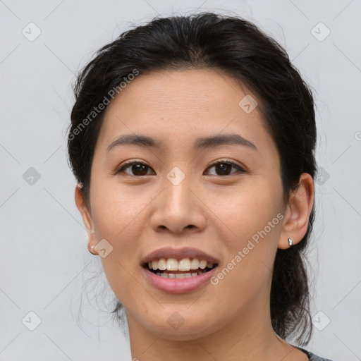 Joyful asian young-adult female with medium  brown hair and brown eyes