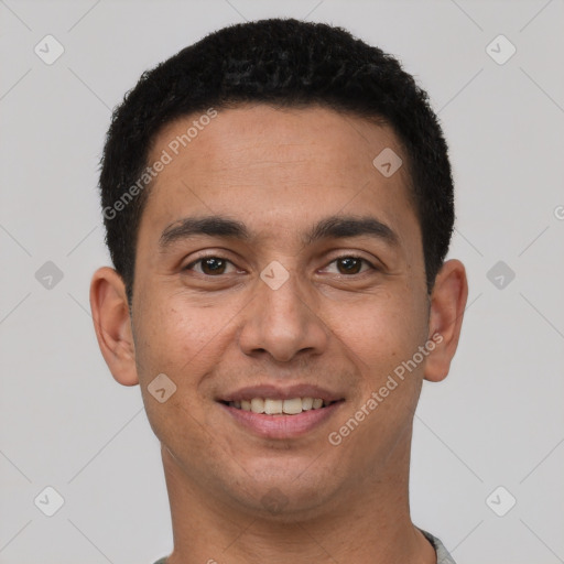 Joyful white young-adult male with short  black hair and brown eyes