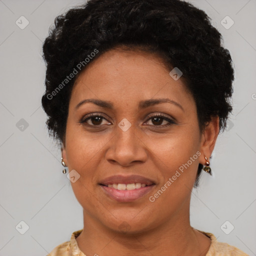 Joyful black adult female with short  brown hair and brown eyes