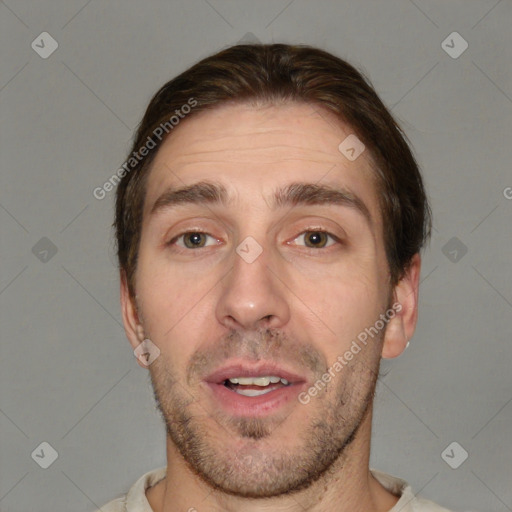 Joyful white adult male with short  brown hair and brown eyes