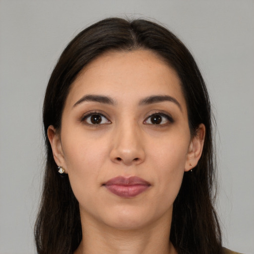 Joyful white young-adult female with long  brown hair and brown eyes