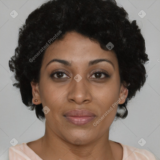 Joyful black adult female with short  brown hair and brown eyes