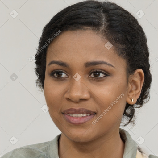 Joyful black young-adult female with medium  brown hair and brown eyes