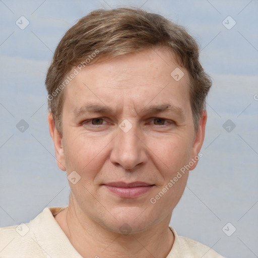 Joyful white adult male with short  brown hair and grey eyes