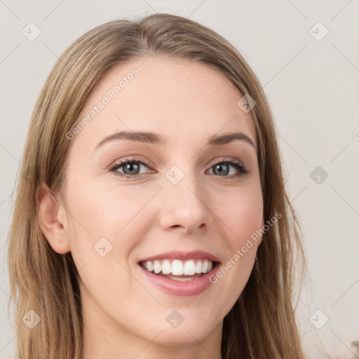 Joyful white young-adult female with long  brown hair and green eyes