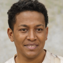 Joyful latino young-adult male with short  brown hair and brown eyes