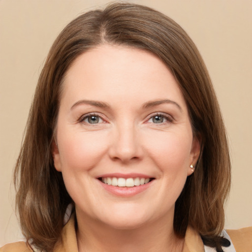 Joyful white young-adult female with medium  brown hair and grey eyes