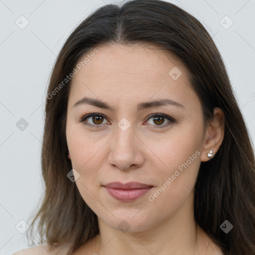 Joyful white young-adult female with long  brown hair and brown eyes